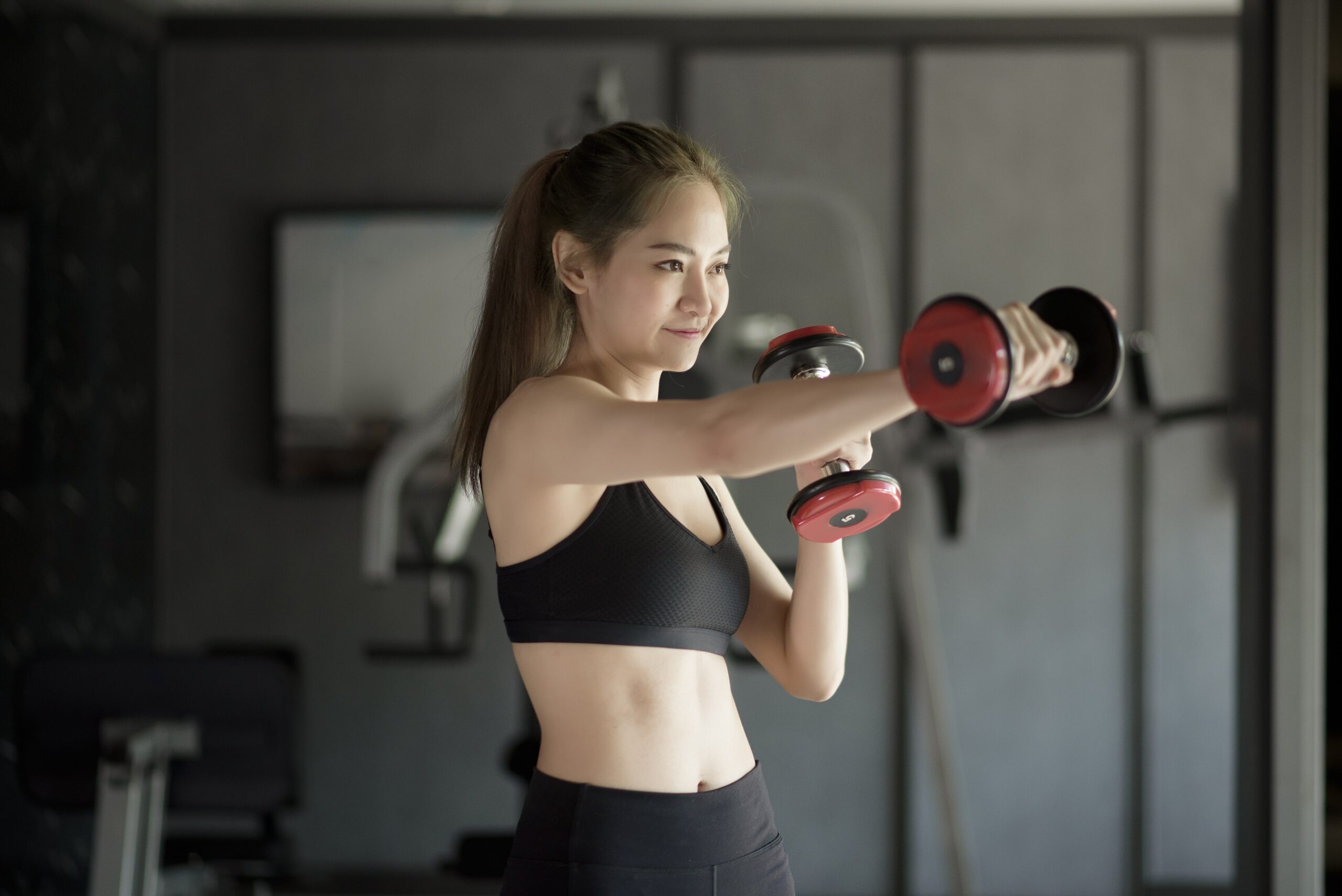 beautiful-young-woman-sportswear-exercising-with-dumbbells-gym-concept-healthy-lifestyle-sports-training-wellness-sport-min